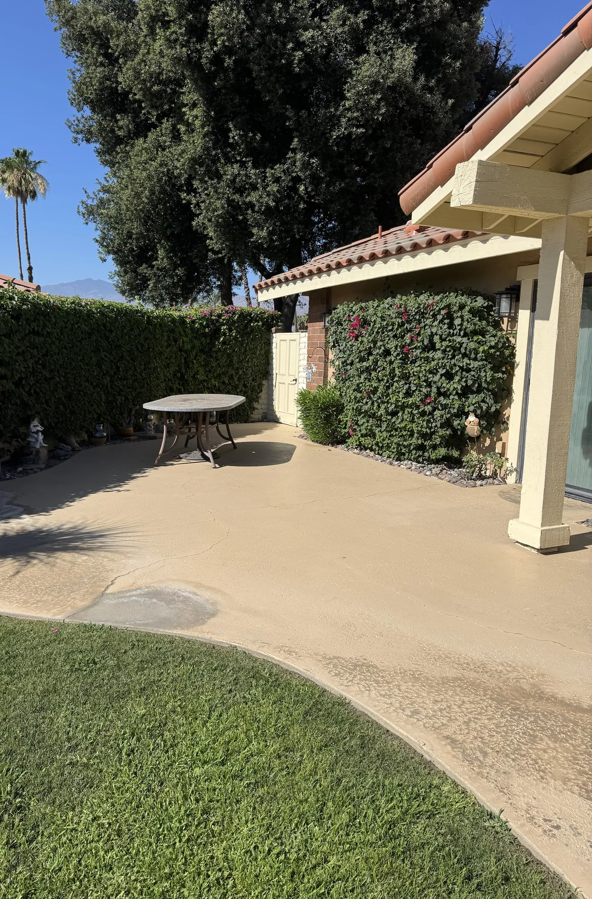 Before: Palm Desert patio, stained and cracked concrete