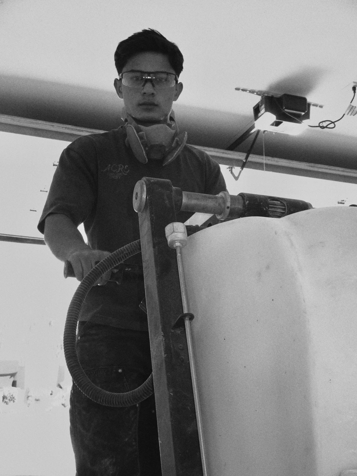 Rooney, Acre founder, working with floor preparation equipment